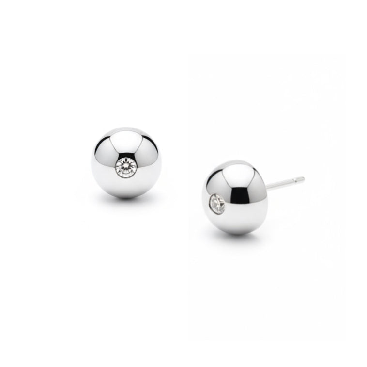 Pair of silver ball earrings with embedded stones on a white background