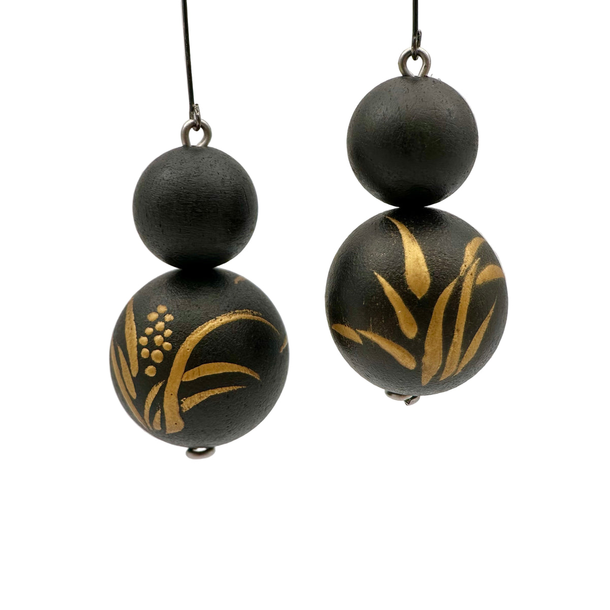 Acorus Grass Lacquer Quasi-Maki-e Earrings — Black and gold beaded earrings on a light gray background