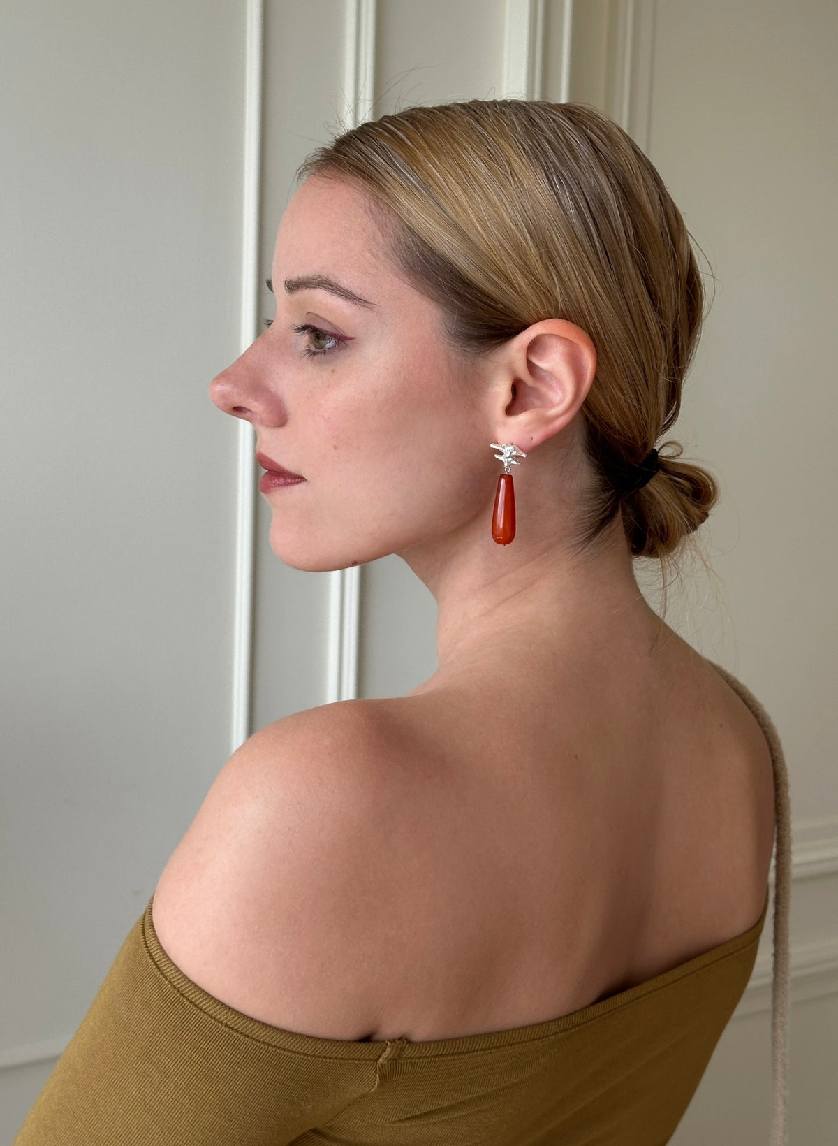 Amazon · Spine & Quartz Raindrop Earrings — Woman wearing a gold top with a neutral background