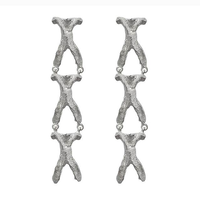 Amazon · Wishbone Long Earrings — Pair of silver branch-like earrings on a white background