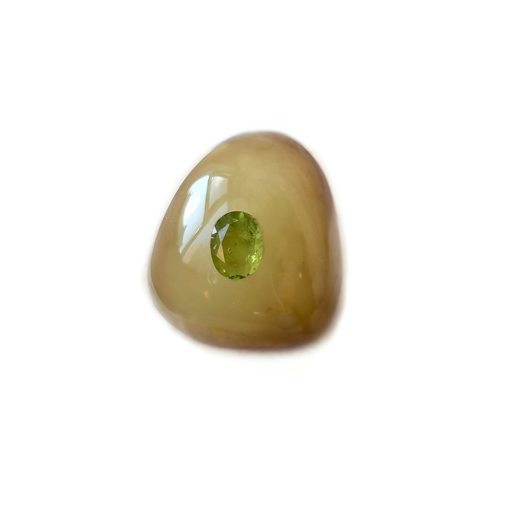 Handcrafted amber brooch featuring an olive green peridot set in natural raw skin beeswax amber.