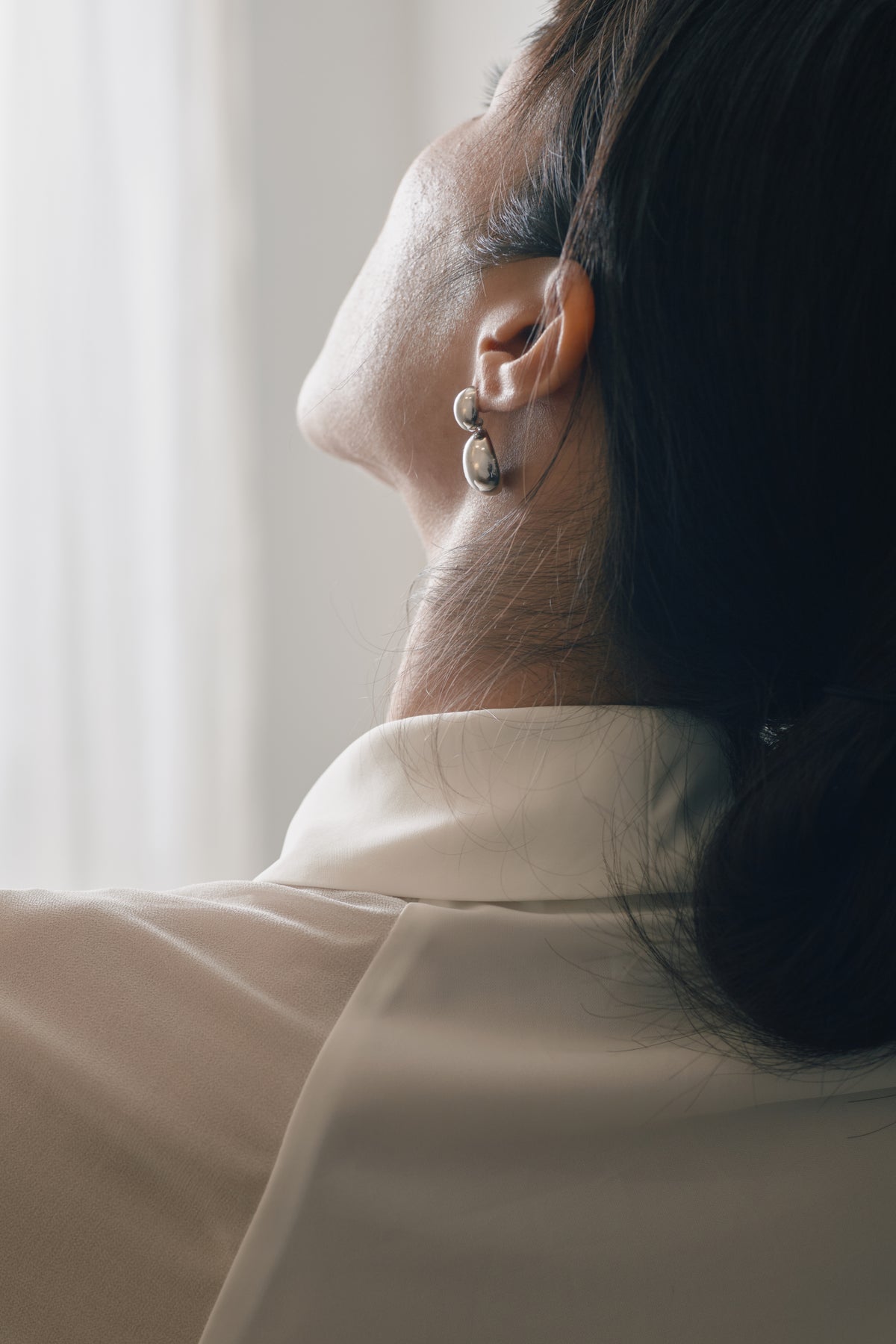 Ant Silhouette Earrings — MIIISELF modern smooth curve earrings inspired by the ant’s form and nature’s energy.