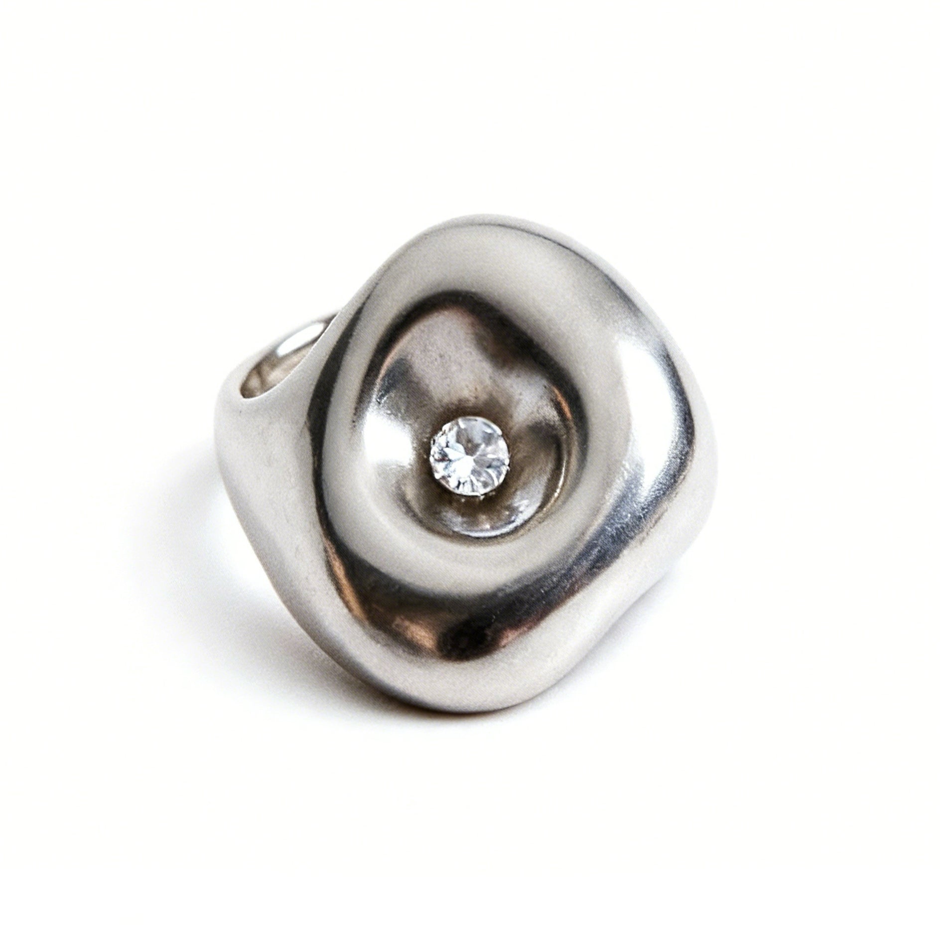 Silver ring with a diamond on a white background