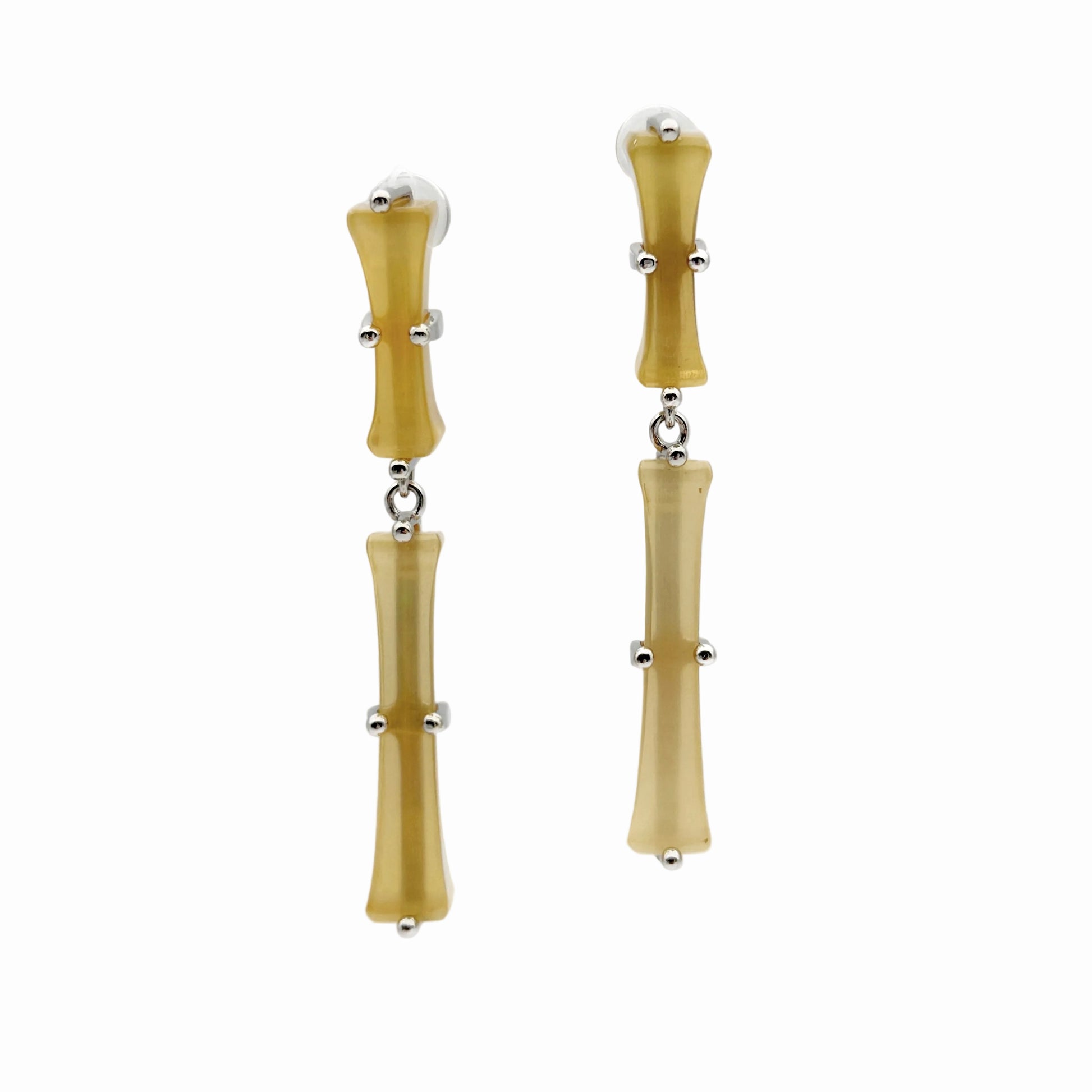 Pair of bamboo-shaped earrings on a white background