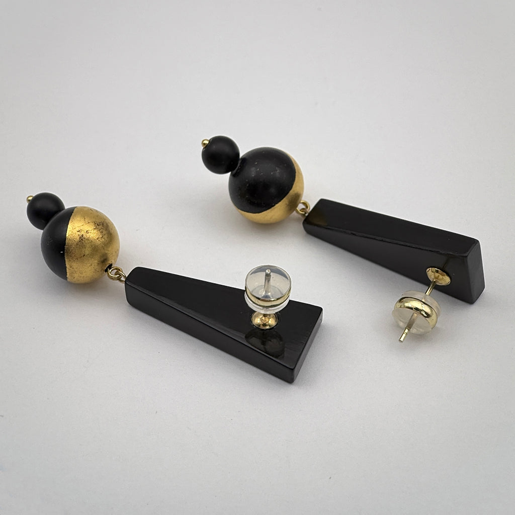 Black Mountain Lacquer Quasi-Maki-e Earrings — Pair of black and gold earrings on a light gray background
