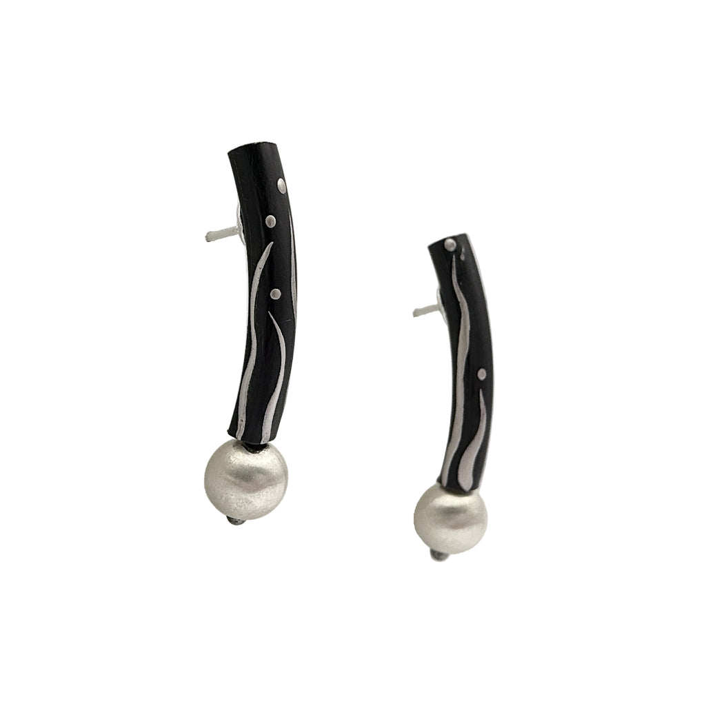 Black Orchid Lacquer Quasi-Maki-e Earrings — Pair of earrings with black and white design on a white background