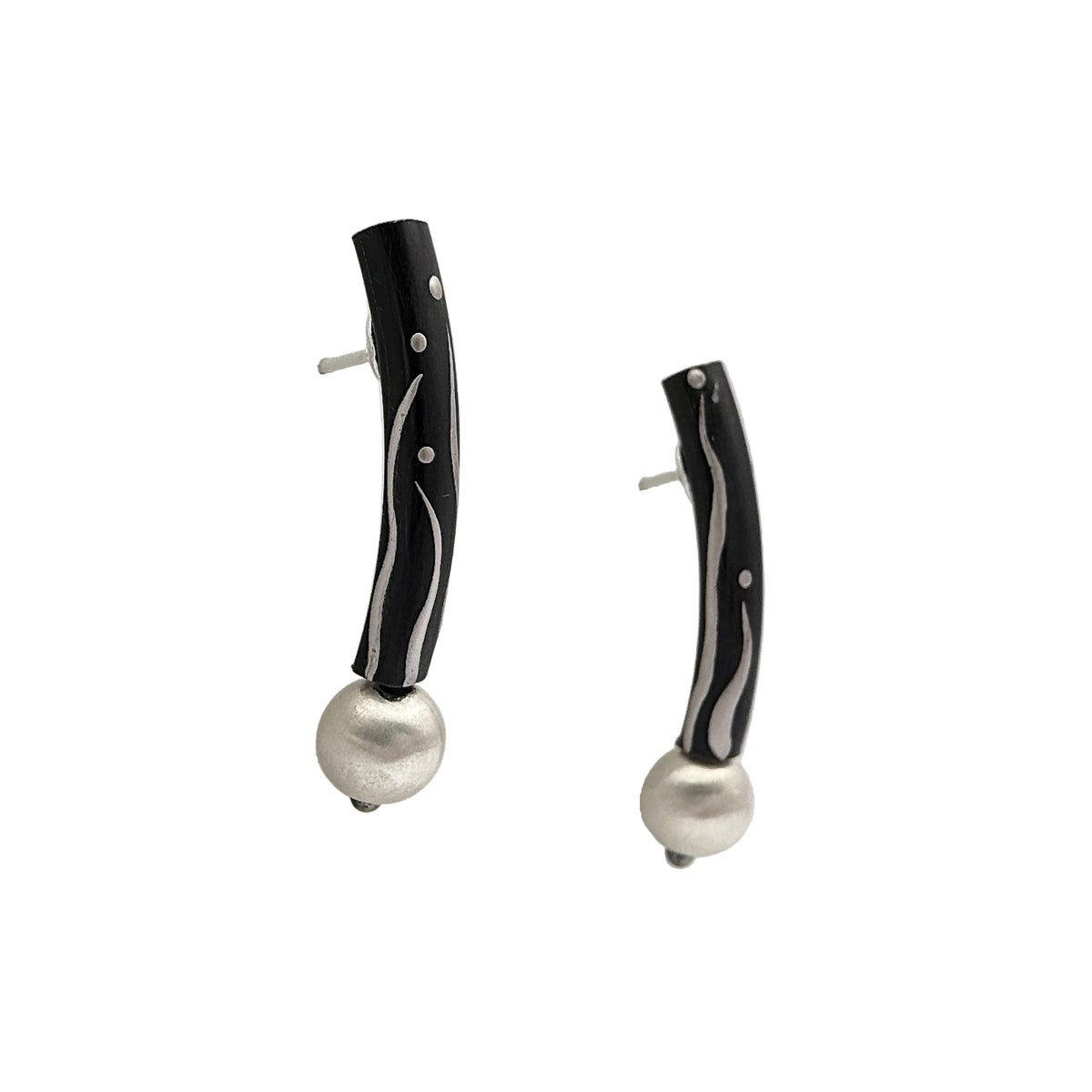 Black Orchid Lacquer Quasi-Maki-e Earrings — Pair of earrings with black and white design on a white background