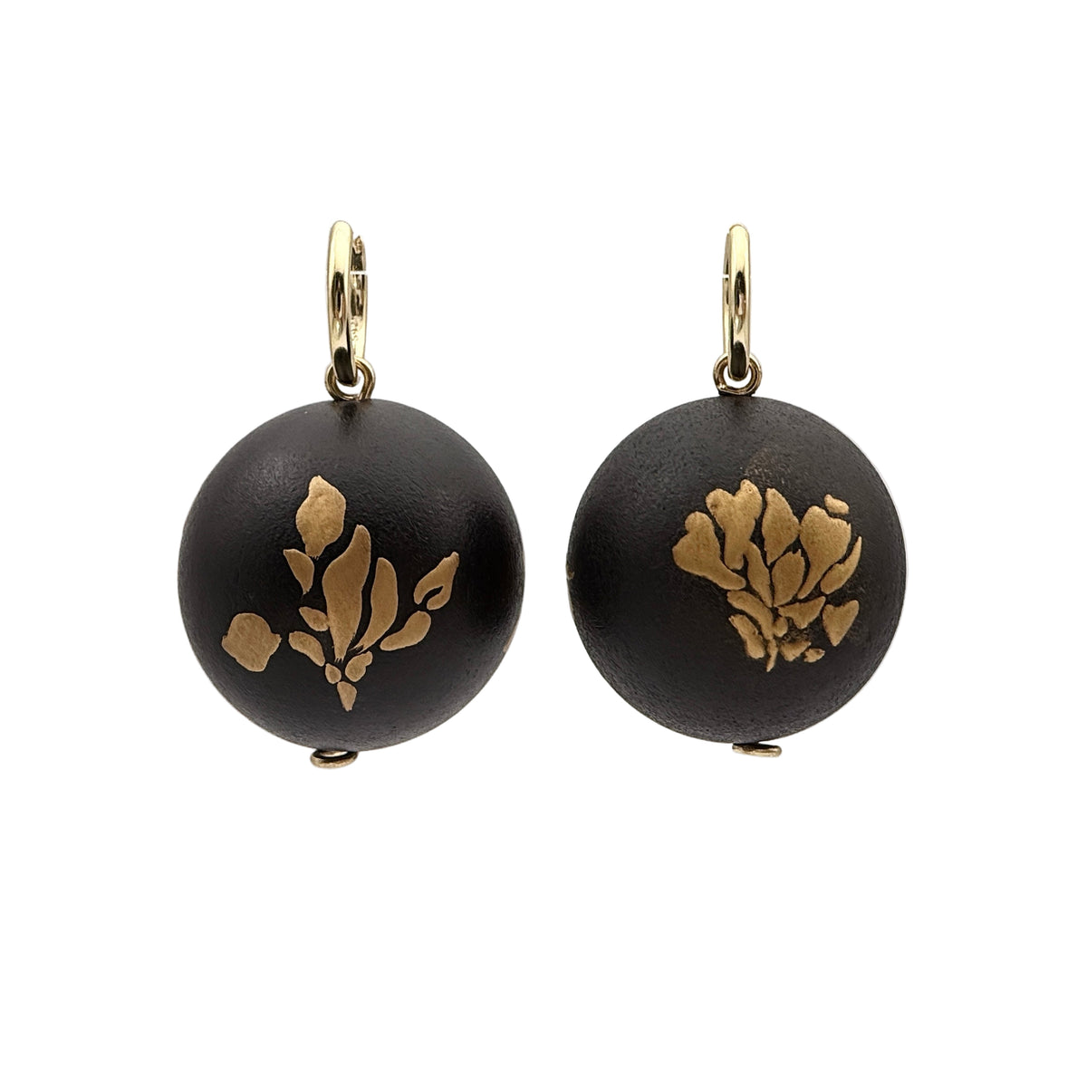 Bloom and Fade Magnolia Lacquer Quasi-Maki-e Earrings — Black earrings with gold floral designs on a clear background