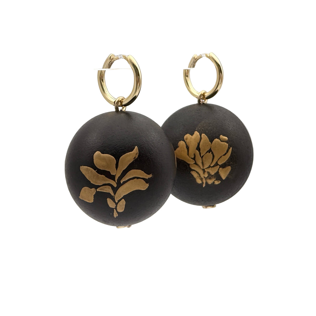Bloom and Fade Magnolia Lacquer Quasi-Maki-e Earrings — Black earrings with gold floral designs on a white background