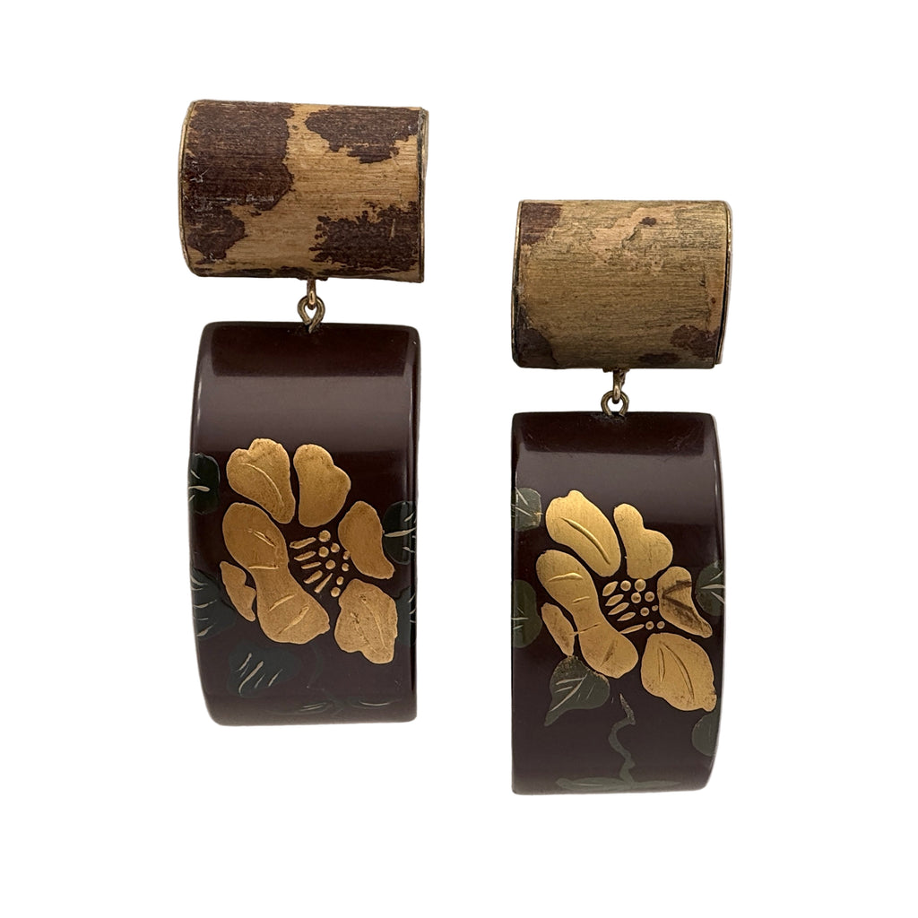 Camellia Lacquer Quasi-Maki-e Earrings — Pair of earrings with gold floral design on brown background