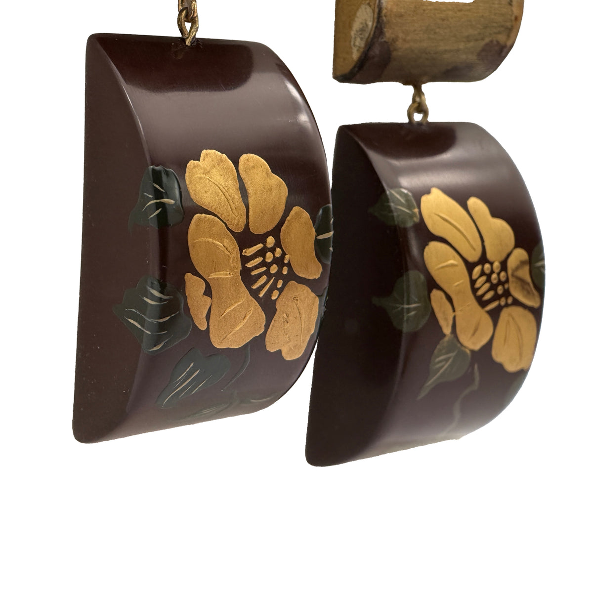 Camellia Lacquer Quasi-Maki-e Earrings — Pair of earrings with floral design on a white background