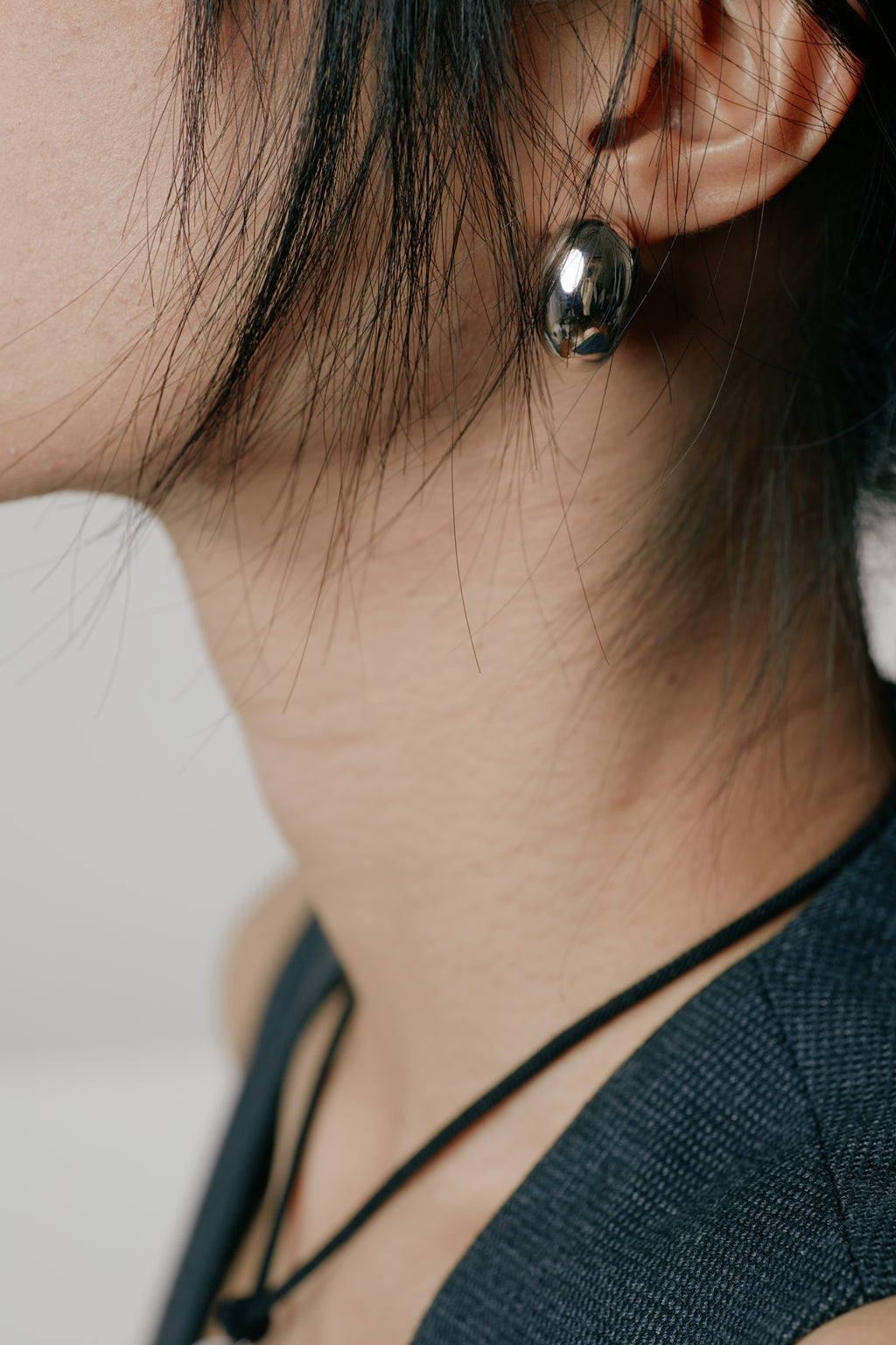 Cashew Curve Silver Earrings — MIIISELF sculptural silver earrings inspired by the natural curve of a cashew, crafted in