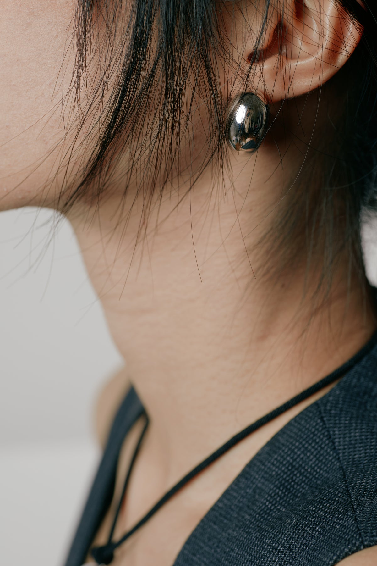 Cashew Curve Silver Earrings — MIIISELF sculptural silver earrings inspired by the natural curve of a cashew, crafted in
