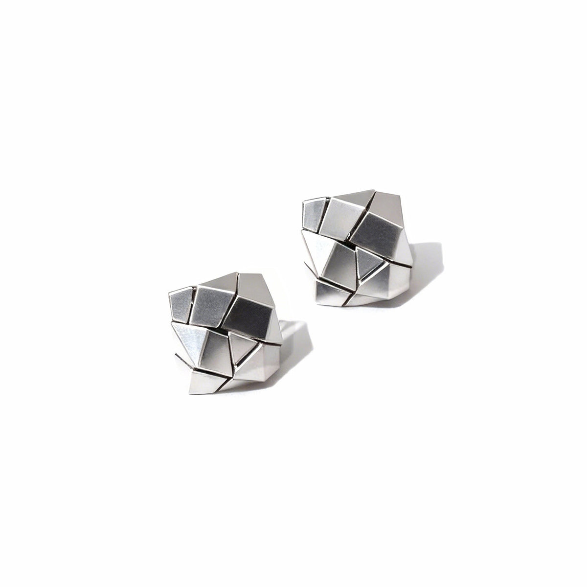 Cracks · Gold-plated Silver Earrings — Pair of geometric silver earrings on a white background