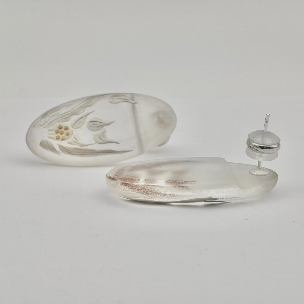 Crystal Hyacinth Lacquer Quasi-Maki-e Earrings — Silver earring and its packaging on a light gray background