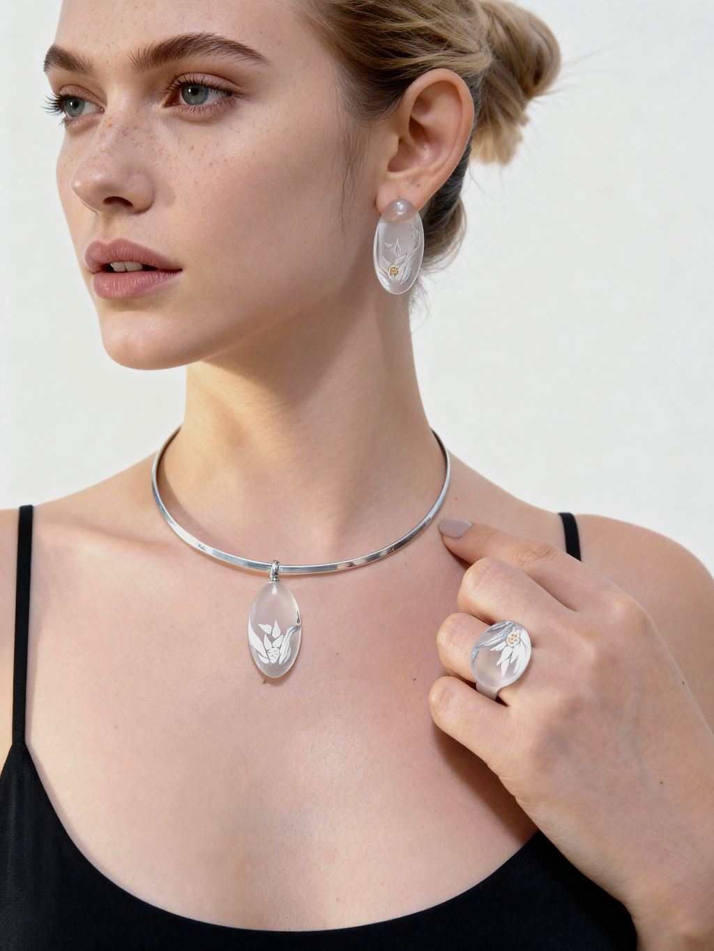 Crystal Hyacinth Lacquer Quasi Maki — Woman wearing silver jewelry including a necklace, earrings, and ring on a plain