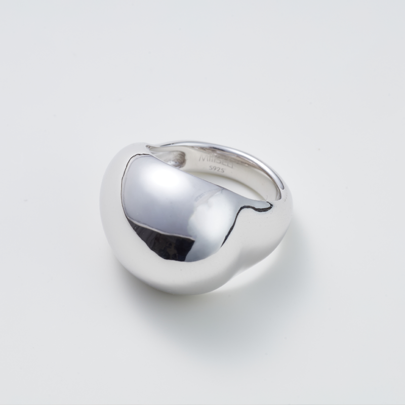 Egg Silhouette Silver Ring — Silver ring on a light gray background