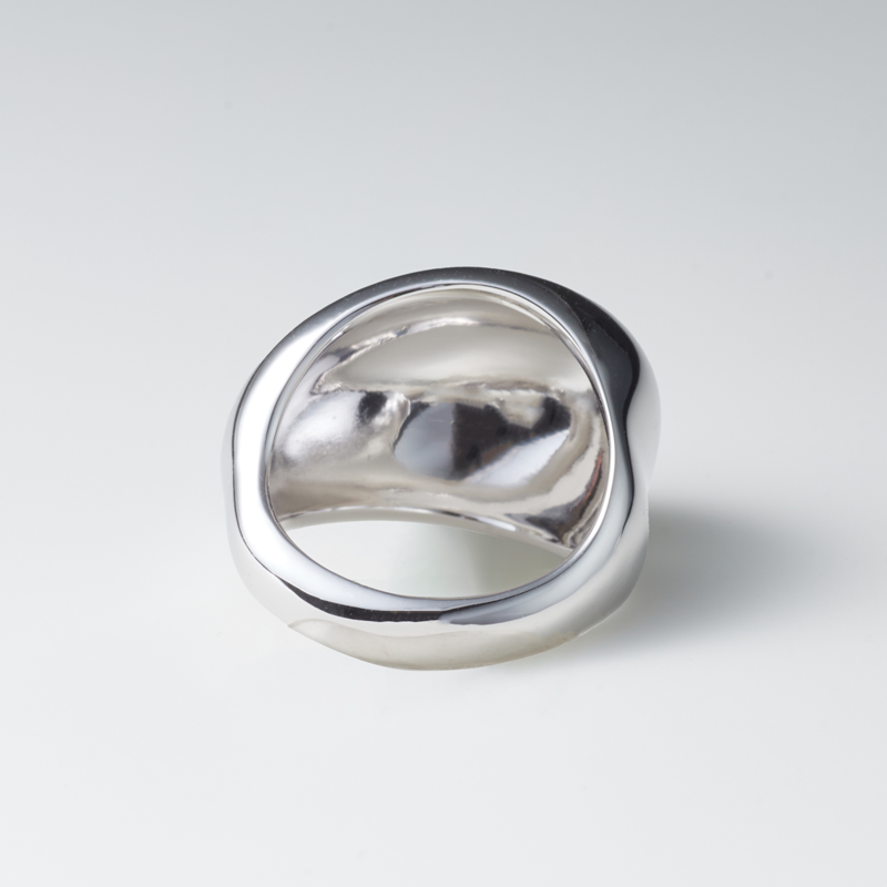 Egg Silhouette Silver Ring — Silver ring on a light gray background