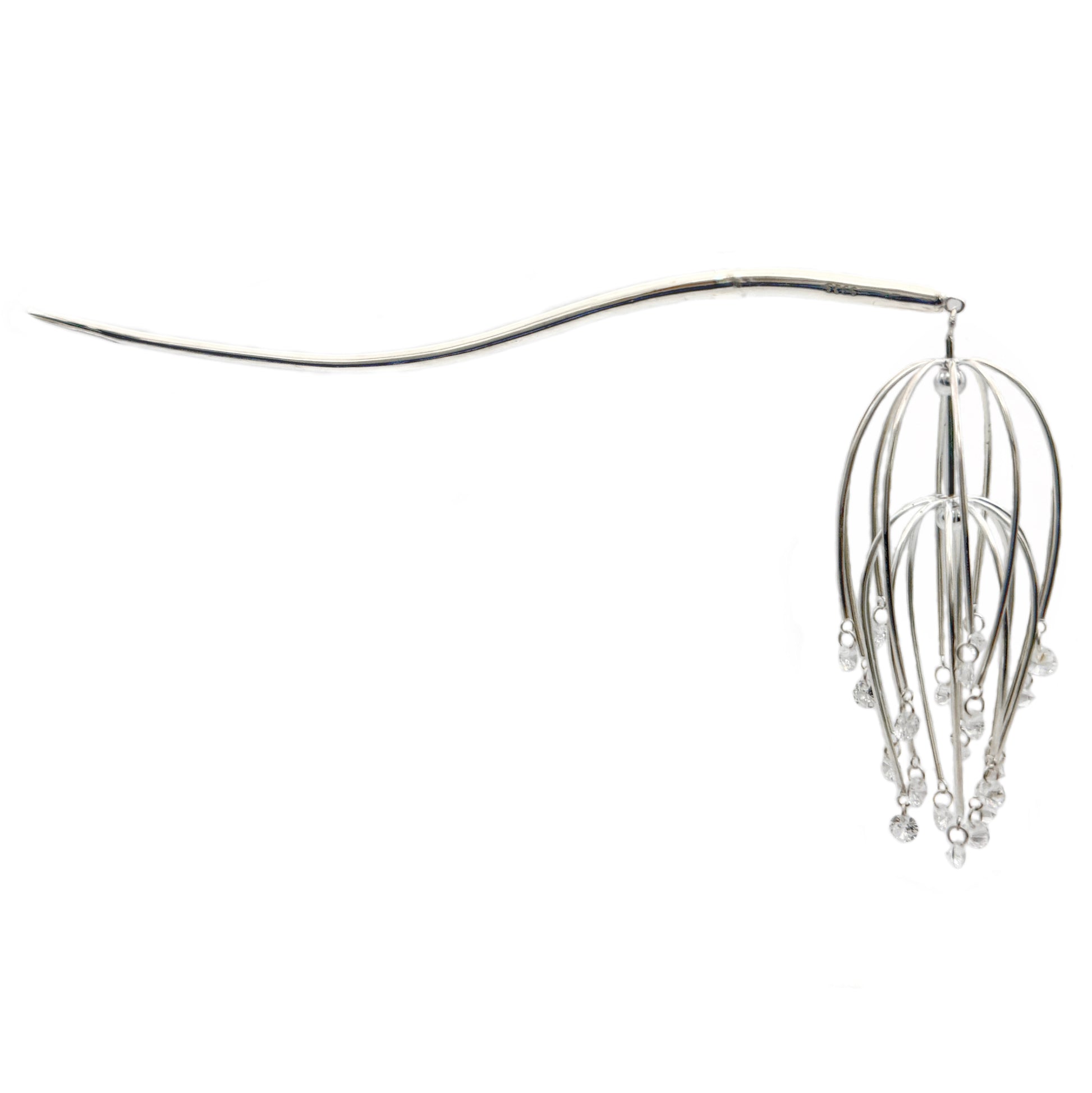 Silver hair accessory with hanging elements on a white background