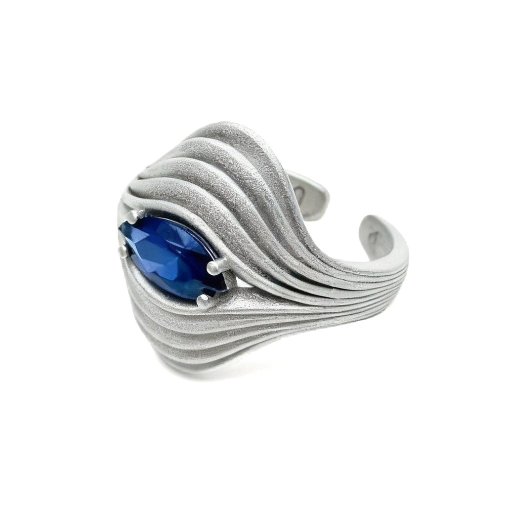 Eye of the Nebula · Sapphire & Silver Ring — Silver ring with a blue gemstone on a white background