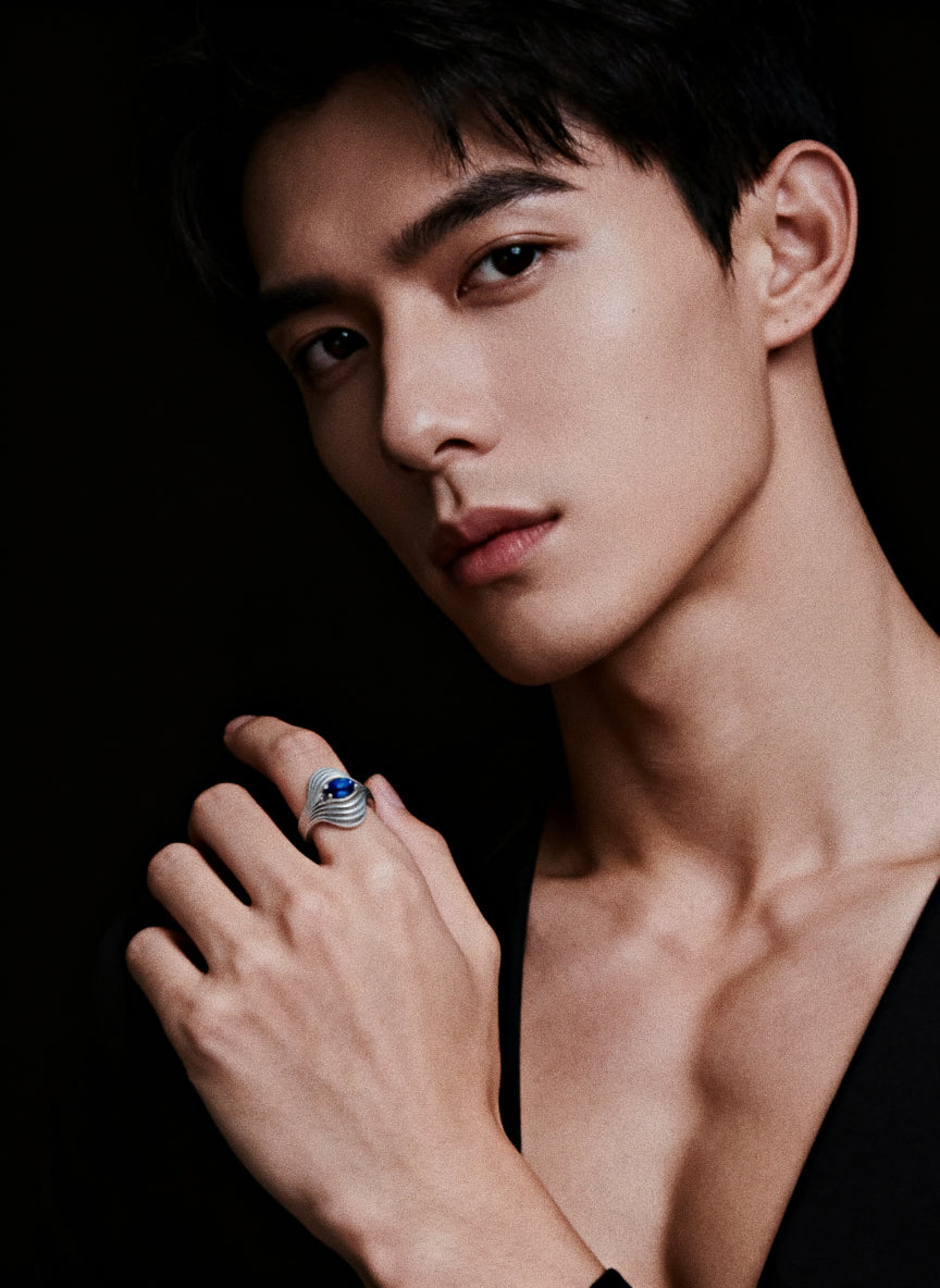 Eye of the Nebula · Sapphire & Silver Ring — Man wearing a ring with a dark background