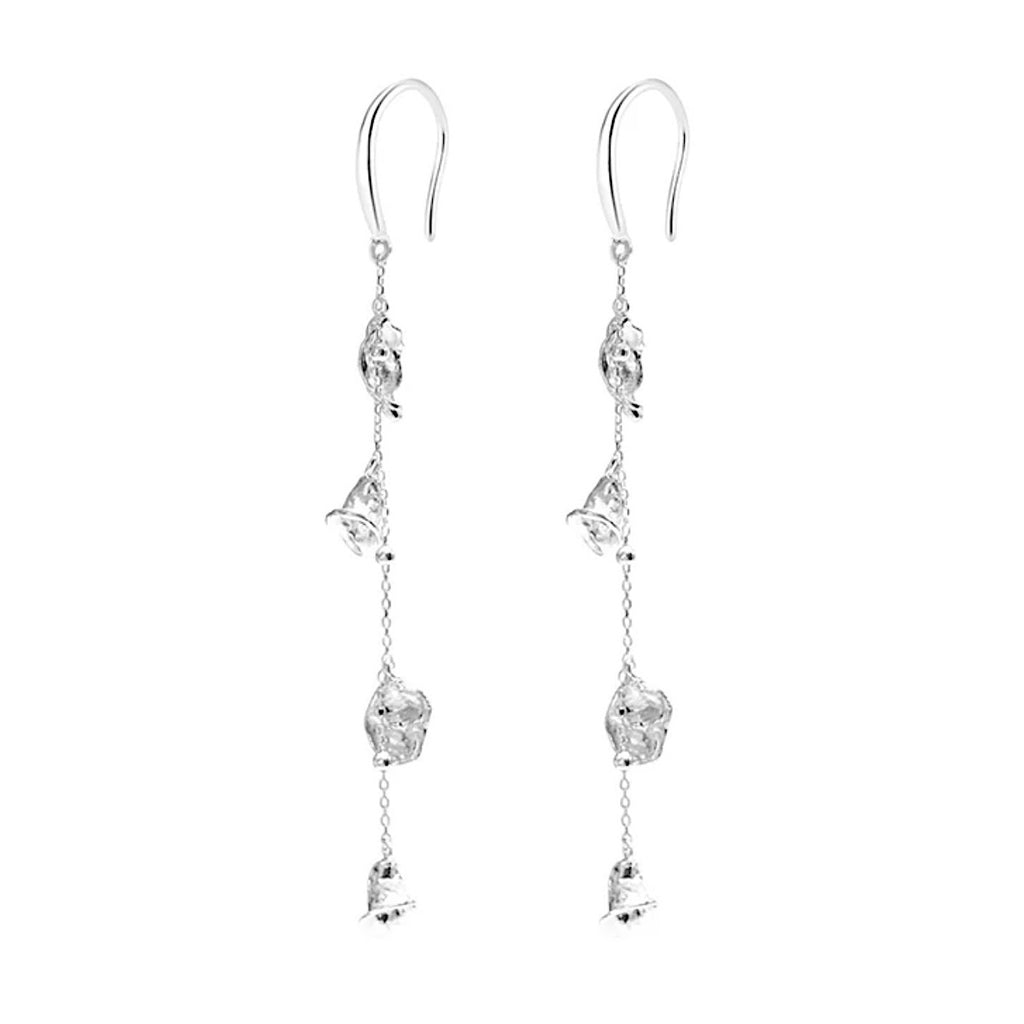 Flora & Blossom Long Earrings — Silver earrings with clear gemstones on a white background