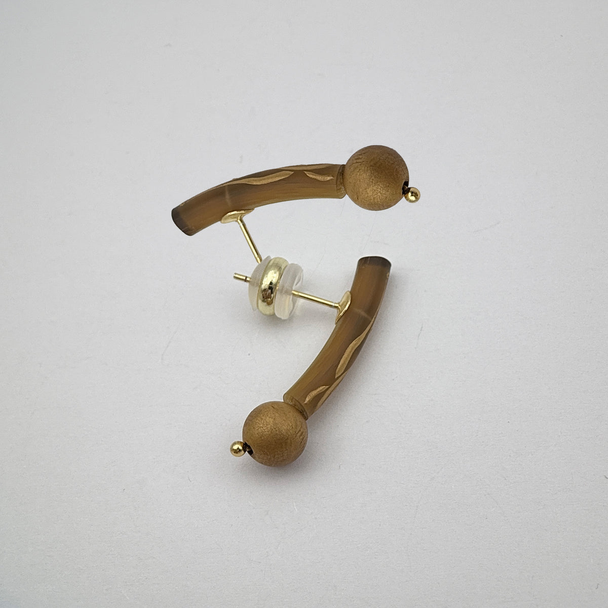 Golden Orchid Lacquer Quasi-Maki-e Earrings — Pair of gold earrings on a light gray background