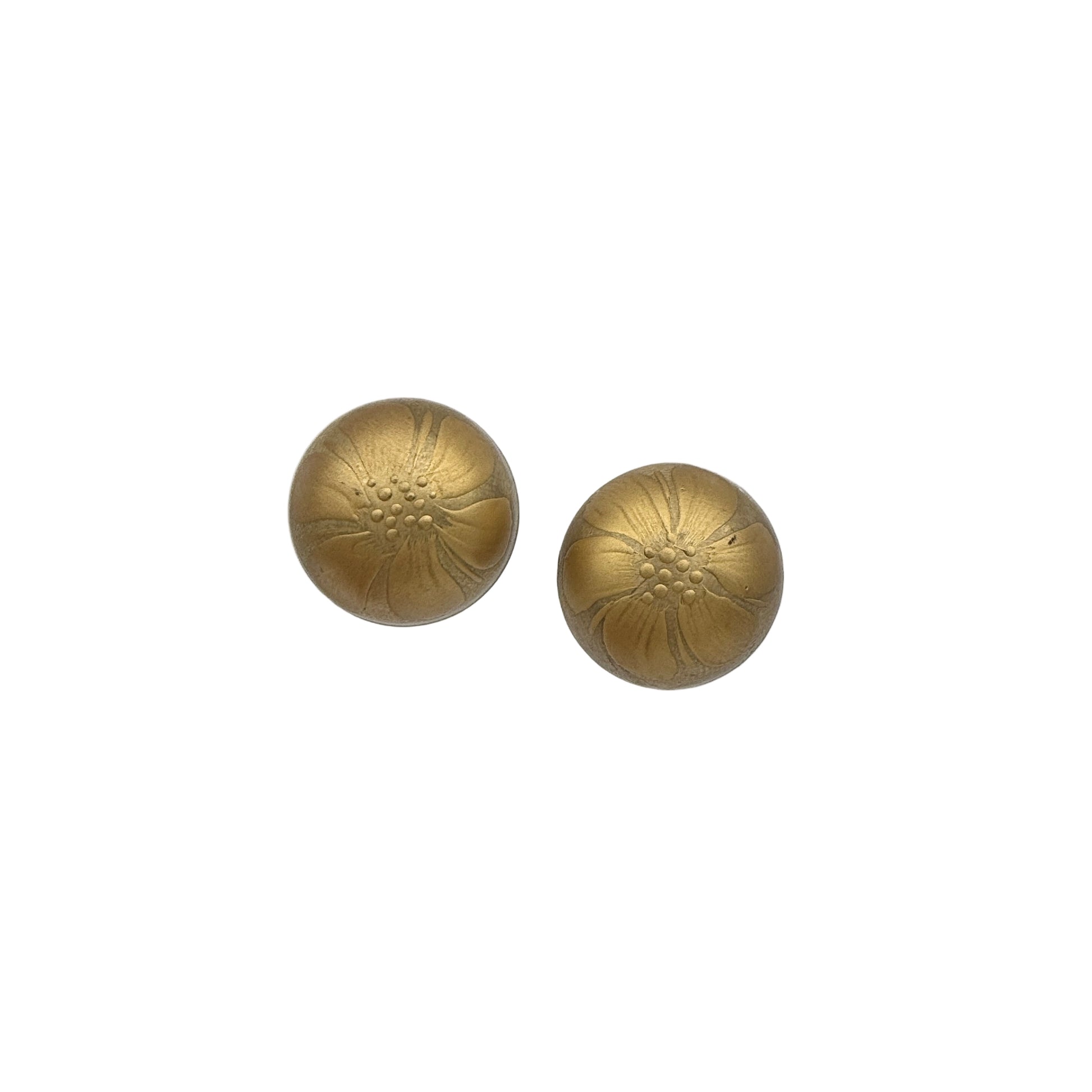 Pair of gold round earrings on a white background