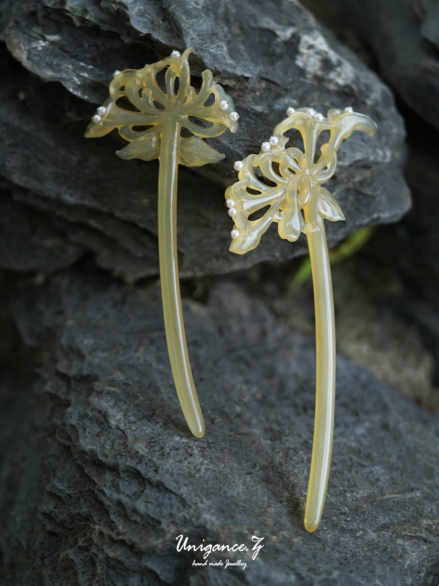 Honeysuckle Pearl Hairpin — Decorative hairpins on a stone surface with 'Unigance' branding.