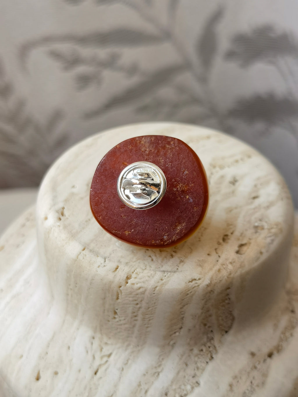 I’m Watching You · Amber & Cushion Black Spinel Brooch — Natural raw-skin beeswax amber brooch with a faceted black spinel