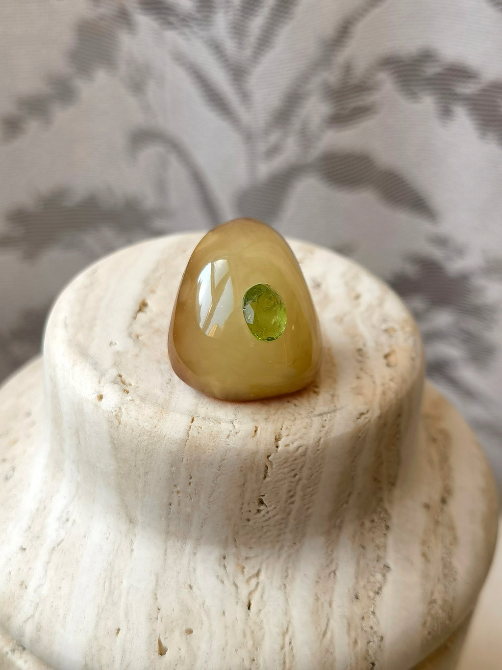 I’m Watching You · Handcrafted Amber & Peridot Brooch — Natural beeswax amber brooch with a single peridot gemstone, glowing