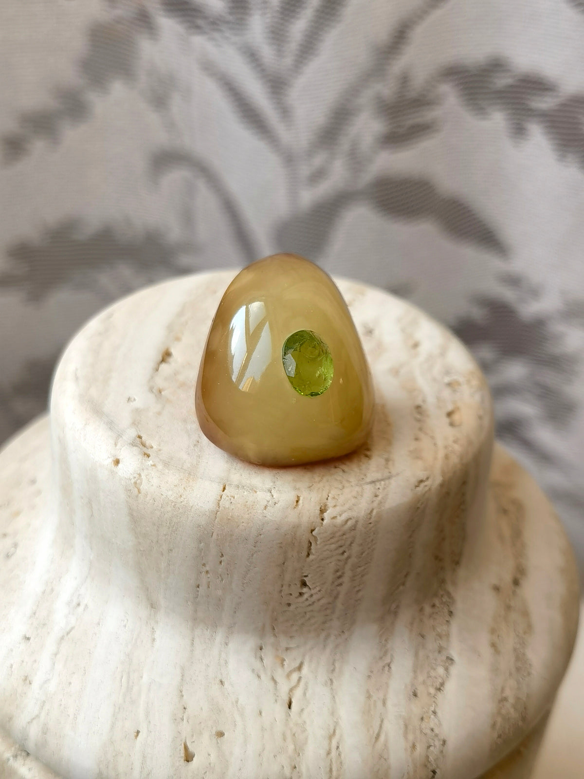 I’m Watching You · Handcrafted Amber & Peridot Brooch — Natural beeswax amber brooch with a single peridot gemstone, glowing