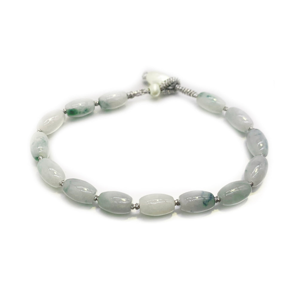 Bracelet with light blue beads on a white background