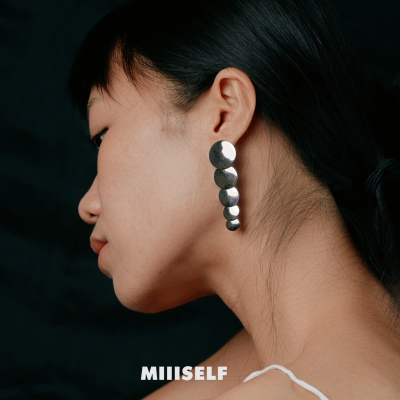 MIIISELF modern minimalist disc earrings crafted in rhodium-plated 925 sterling silver.”