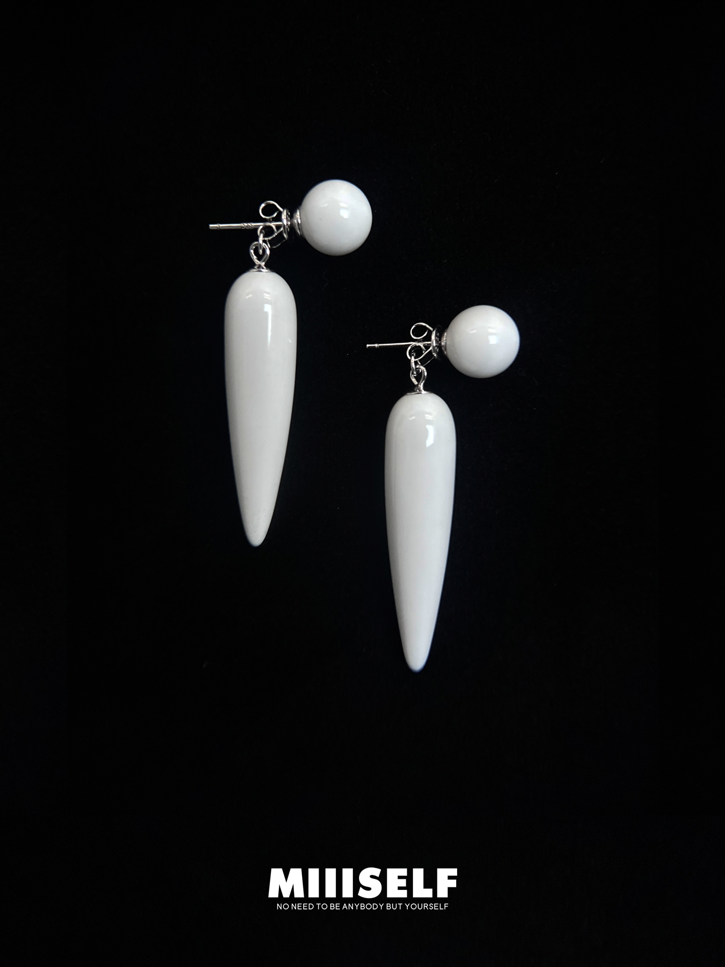 MIIISELF anti-gravity sculptural earrings crafted in rhodium-plated 925 sterling silver with natural white agate.