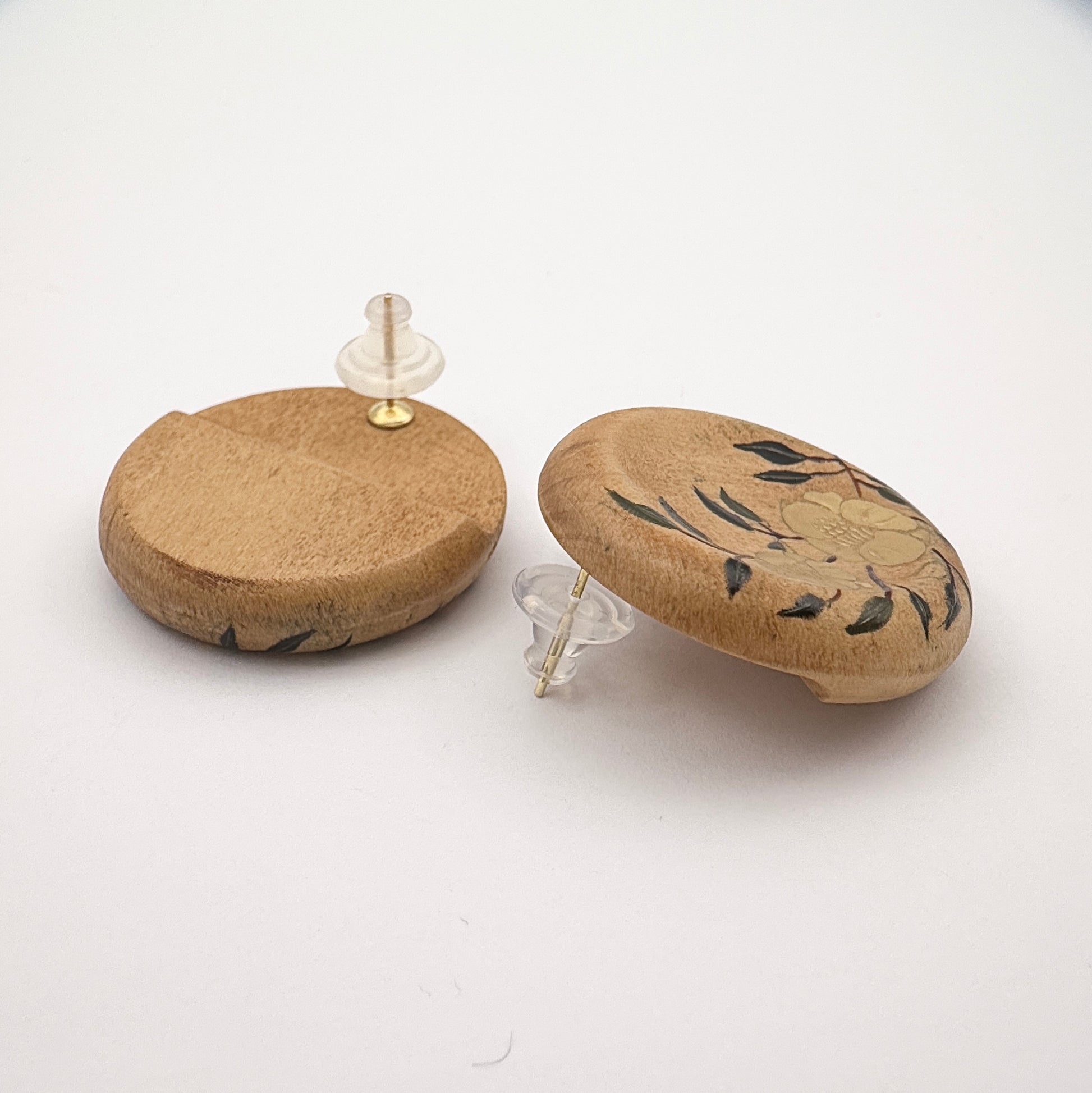 Two cork-based products with decorative elements on a white background