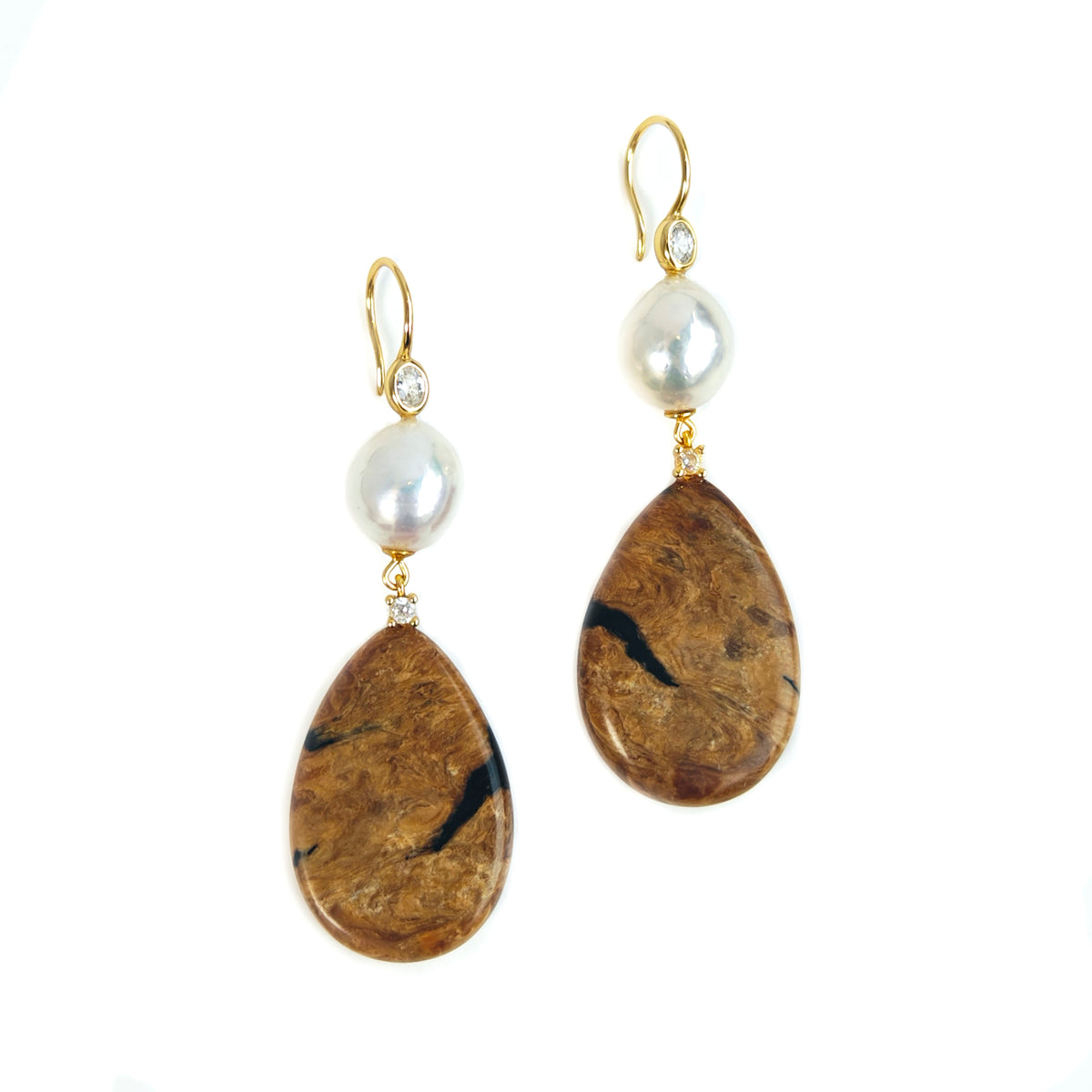 Natural Root Amber & Freshwater Pearl Earrings — Pair of earrings with pearl and brown stone drops on a white background