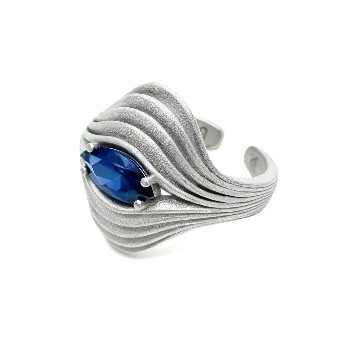 Silver ring with a blue gemstone on a white background