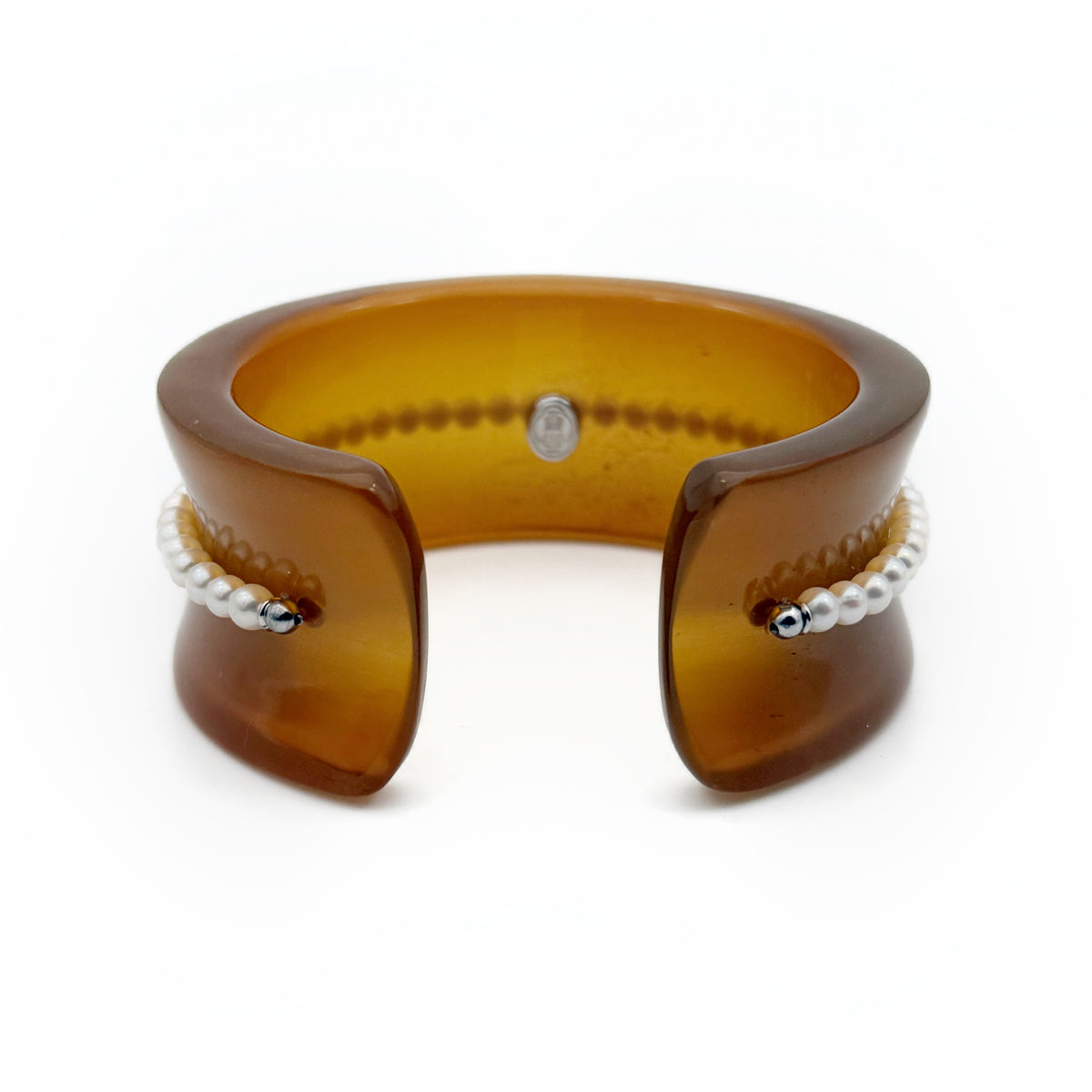 Pearl Inlay Open Cuff Horn Bracelet — Brown bracelet with pearl-like beads on a white background