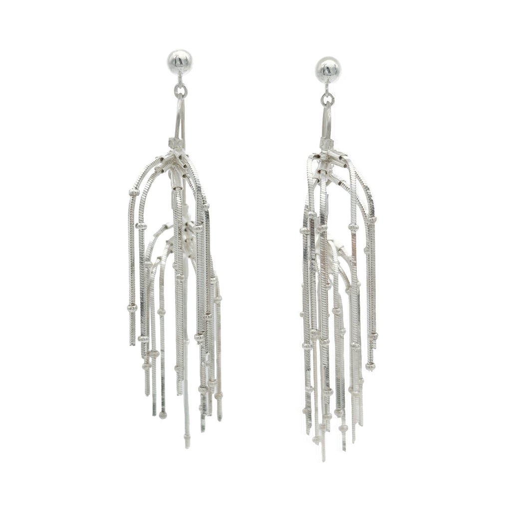 Pine Needle Drop Earrings — Silver fringe earrings on a white background
