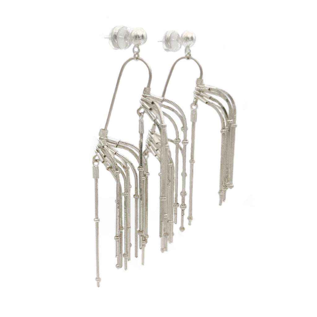 Pine Needle Drop Earrings — Silver fringe earrings on a white background