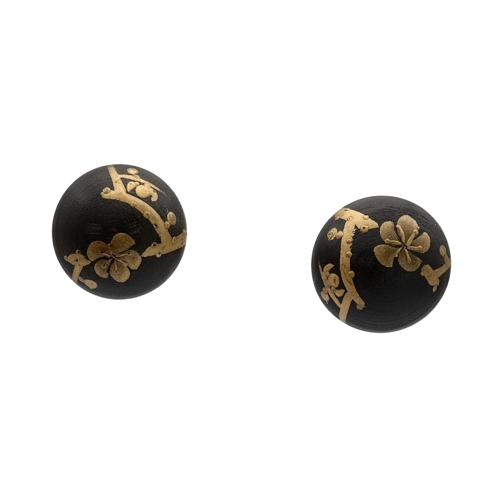 Plum Blossom Lacquer Quasi-Maki-e Stud Earrings — Black earrings with gold floral designs on a white background