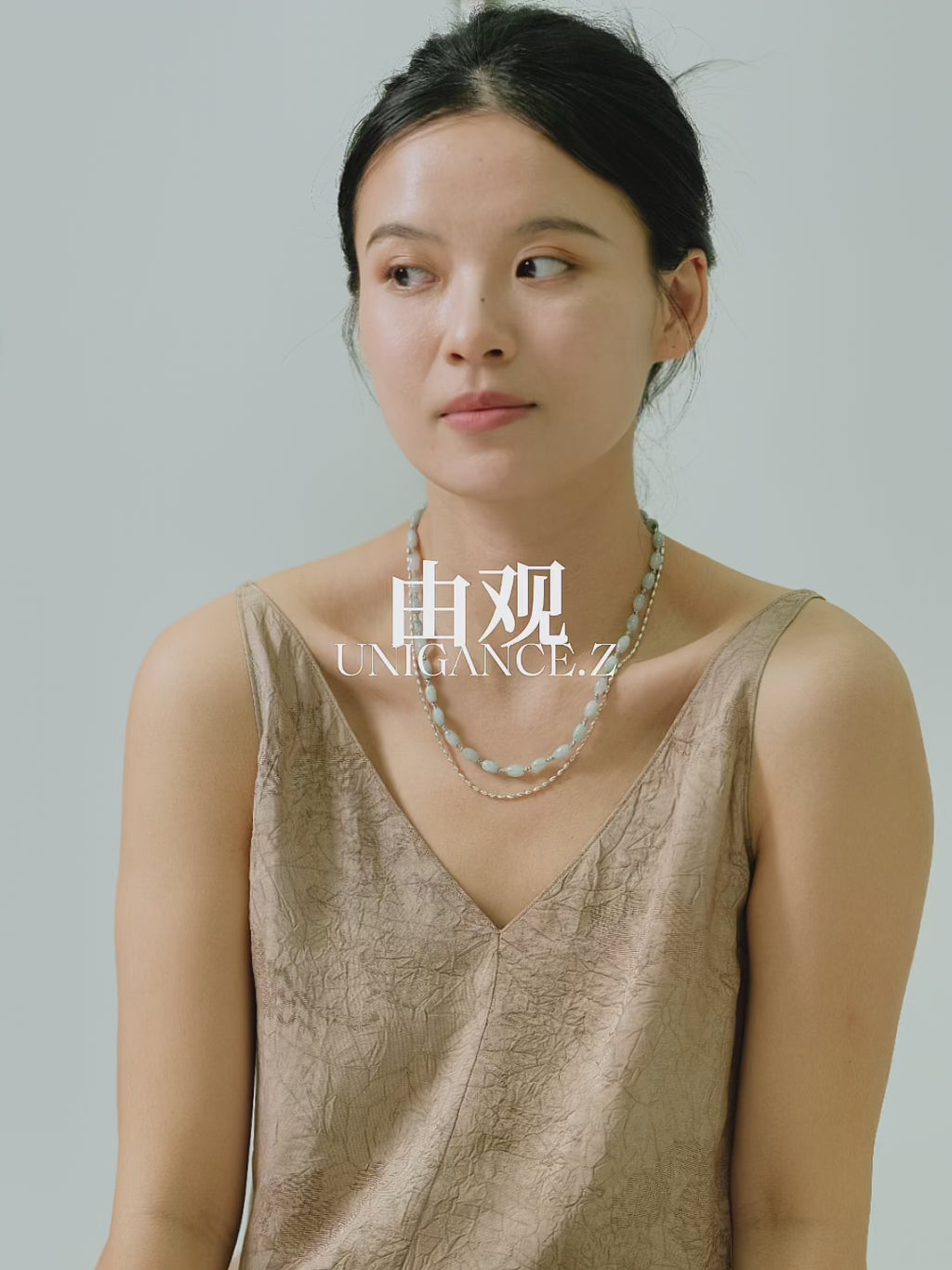 Hand-strung layered jade rice bead necklace featuring natural jade beads and sterling silver silk thread, designed as a lightweight, fluid, and elegant contemporary necklace that reflects abundance, balance, and modern grace.