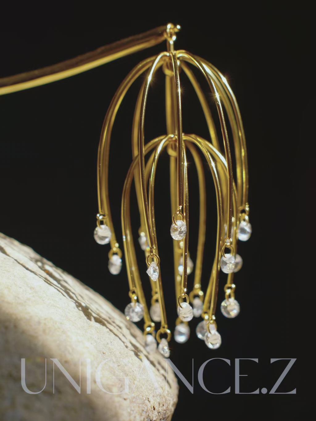 Silver drooping begonia hairpin inspired by classical Chinese garden imagery, featuring cascading floral forms and delicate stones, expressing quiet elegance and graceful restraint.