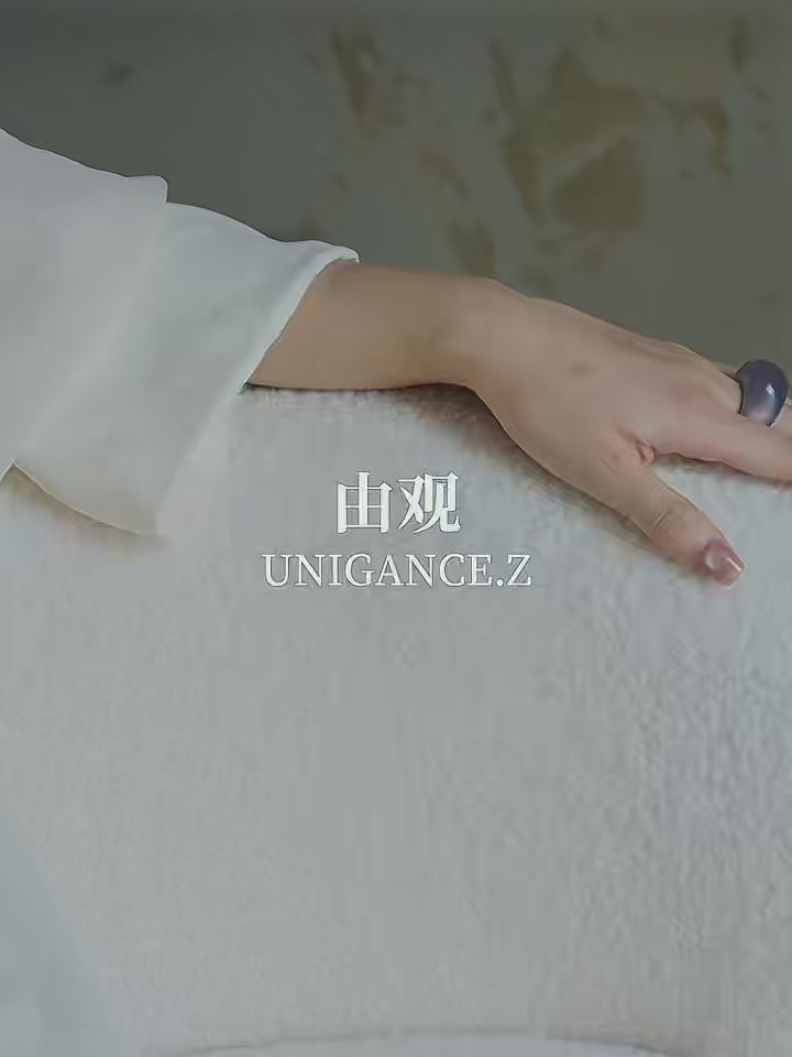 Handcrafted smoky purple jade band ring featuring a smooth jade exterior and a sterling silver interior, inspired by classical Chinese philosophy of balance and harmony, designed as a sculptural modern fine jewelry piece.