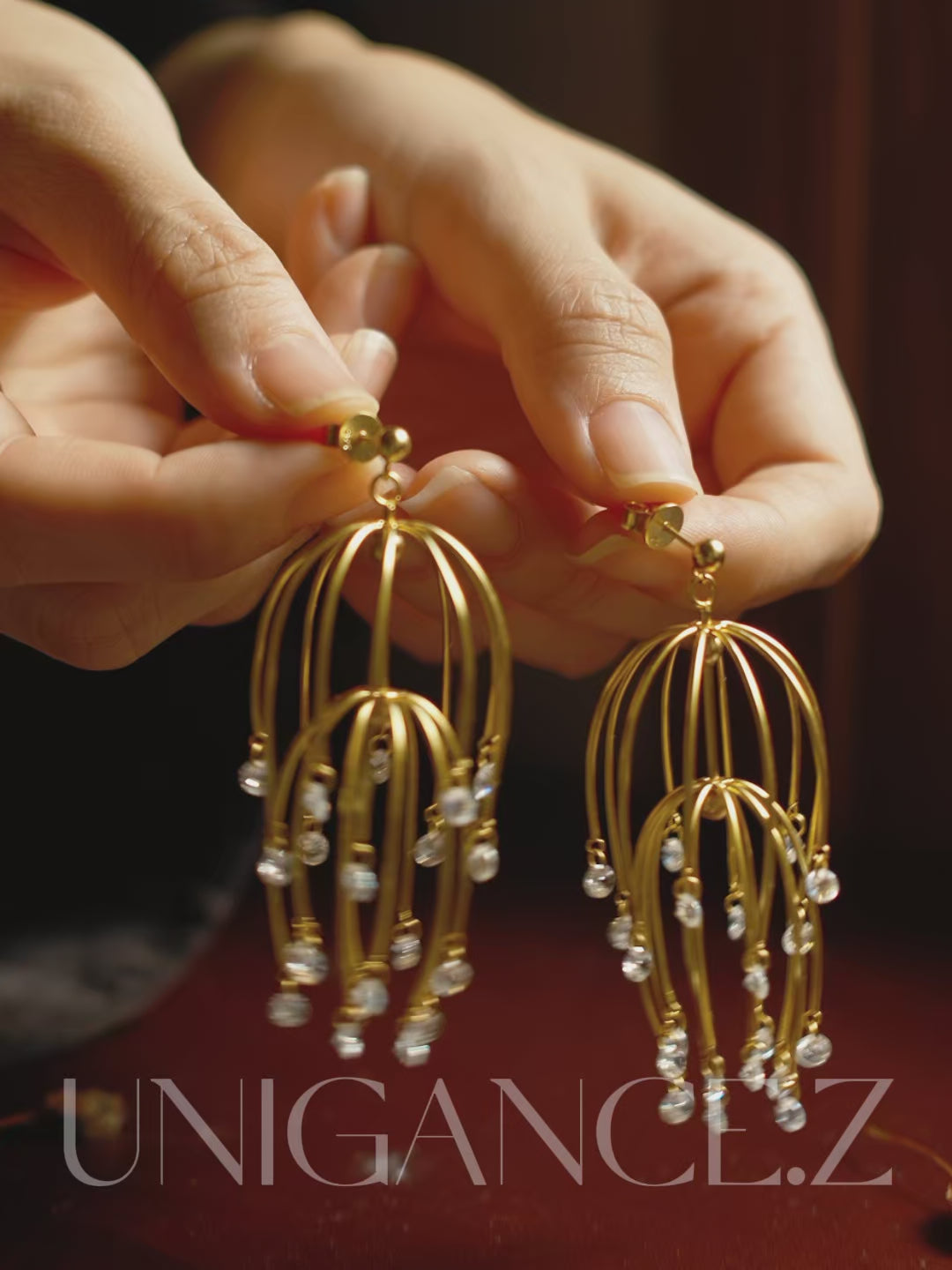 Handcrafted drooping begonia drop earrings in sterling silver, featuring cascading layered blossoms and light-catching stones, inspired by classical Chinese garden imagery, designed to frame the face with soft elegance, rhythm, and refined floral beauty.