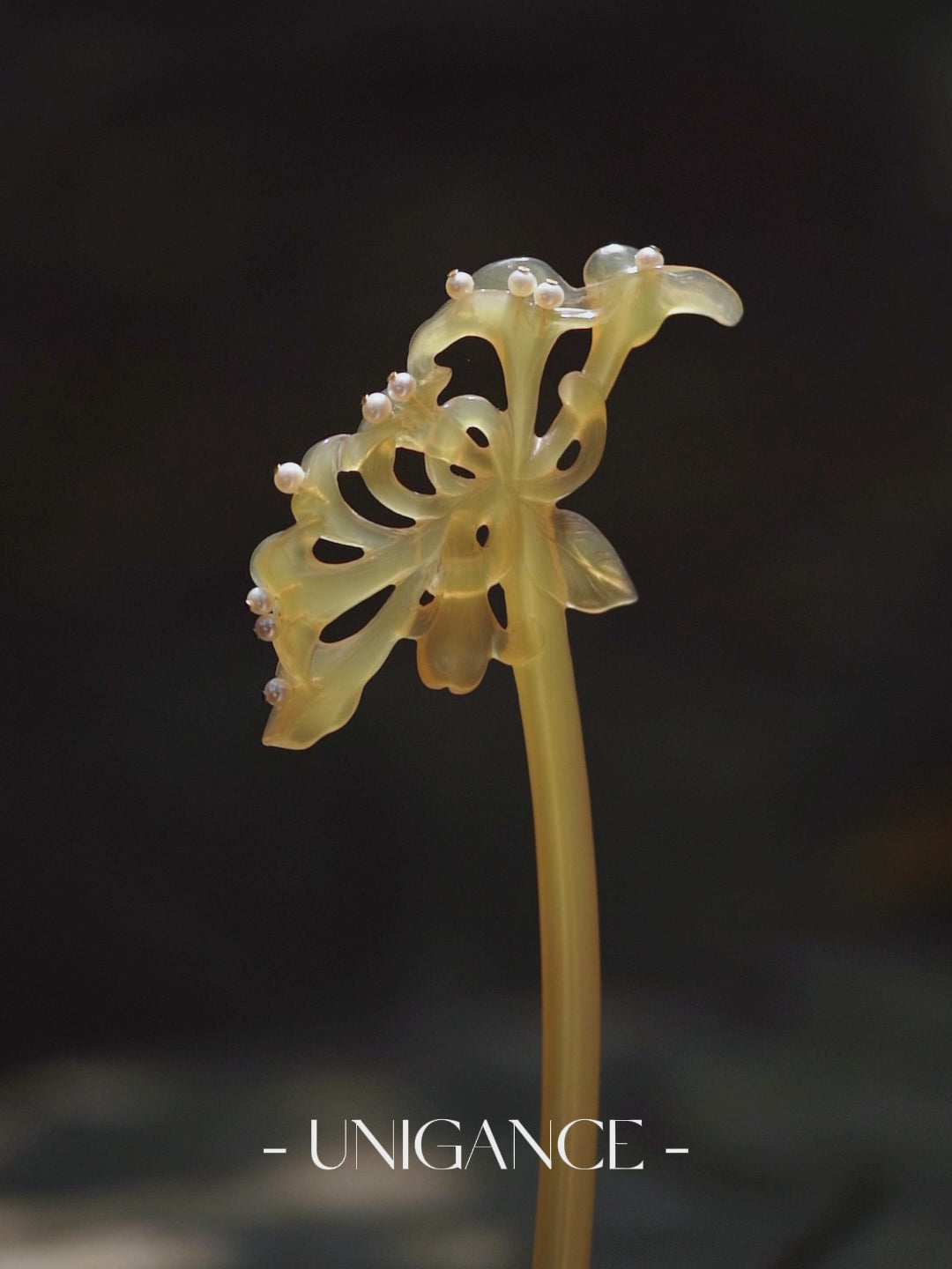 Handcrafted honeysuckle pearl hairpin made from natural horn, delicately hand-carved and accented with pearls and 14K gold-plated metal, inspired by floral symbolism of resilience and designed as an elegant everyday hair accessory.