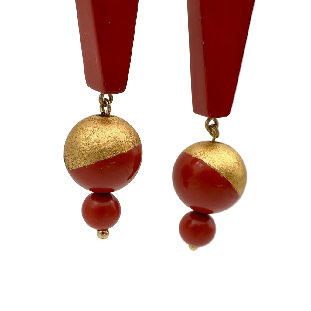 Red Mountain Lacquer Quasi-Maki-e Earrings — Pair of earrings with red and gold beads on a light gray background