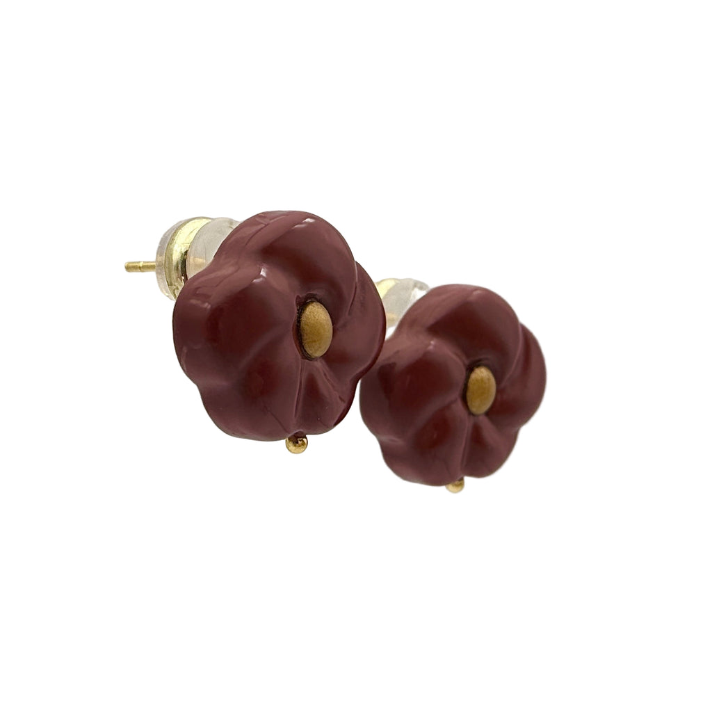 Red Peach Blossom Lacquer Quasi-Maki-e Earrings — Pair of maroon flower-shaped earrings with gold accents on a white