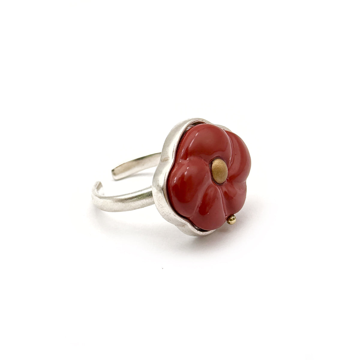 Red Peach Lacquer Quasi-Maki-e Blossom Ring — Ring with a red flower-shaped stone and silver band on a white background